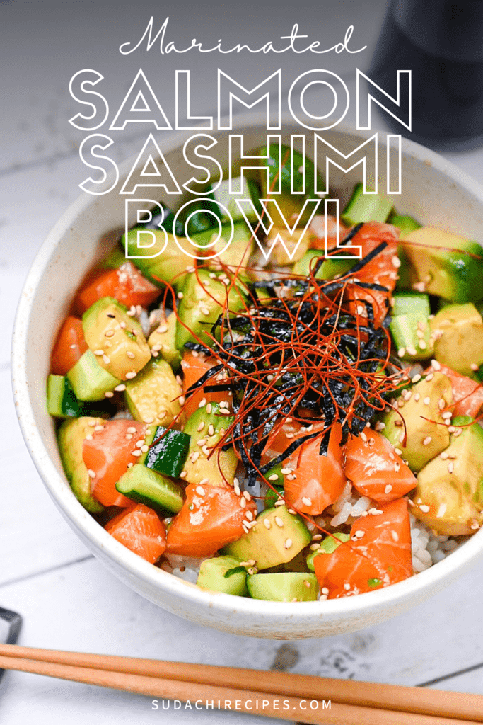 almon sashimi bowl (salmon donburi) in a white bowl topped with kizami nori and chili threads