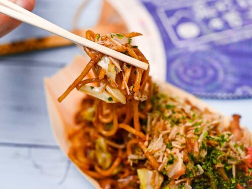 Japanese yakisoba noodles held with chopsticks