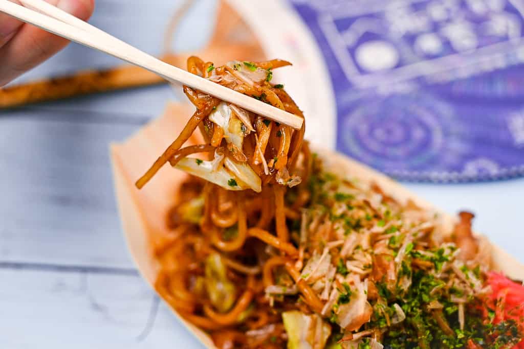 Japanese yakisoba noodles held with chopsticks