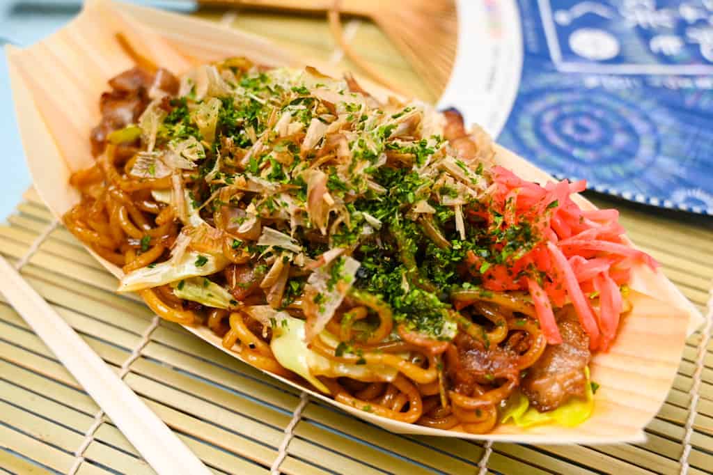 Japanese festival style yakisoba noodles in a bamboo boat top down