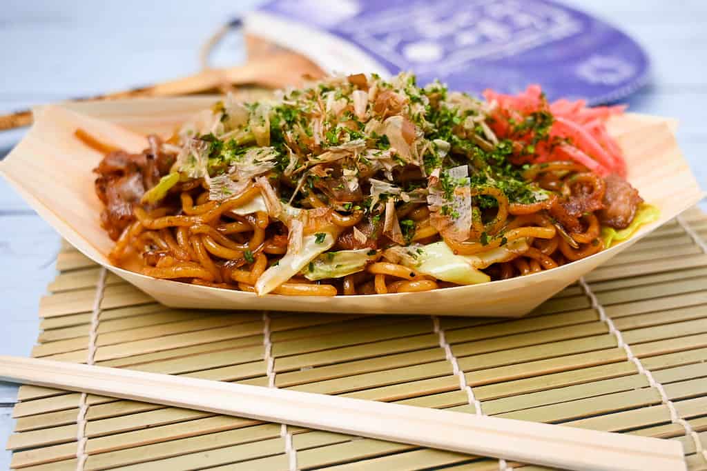 Japanese festival style yakisoba noodles in a bamboo boat side view