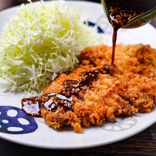 Japanese tonkatsu deep fried pork cutlet drizzled with homemade sauce