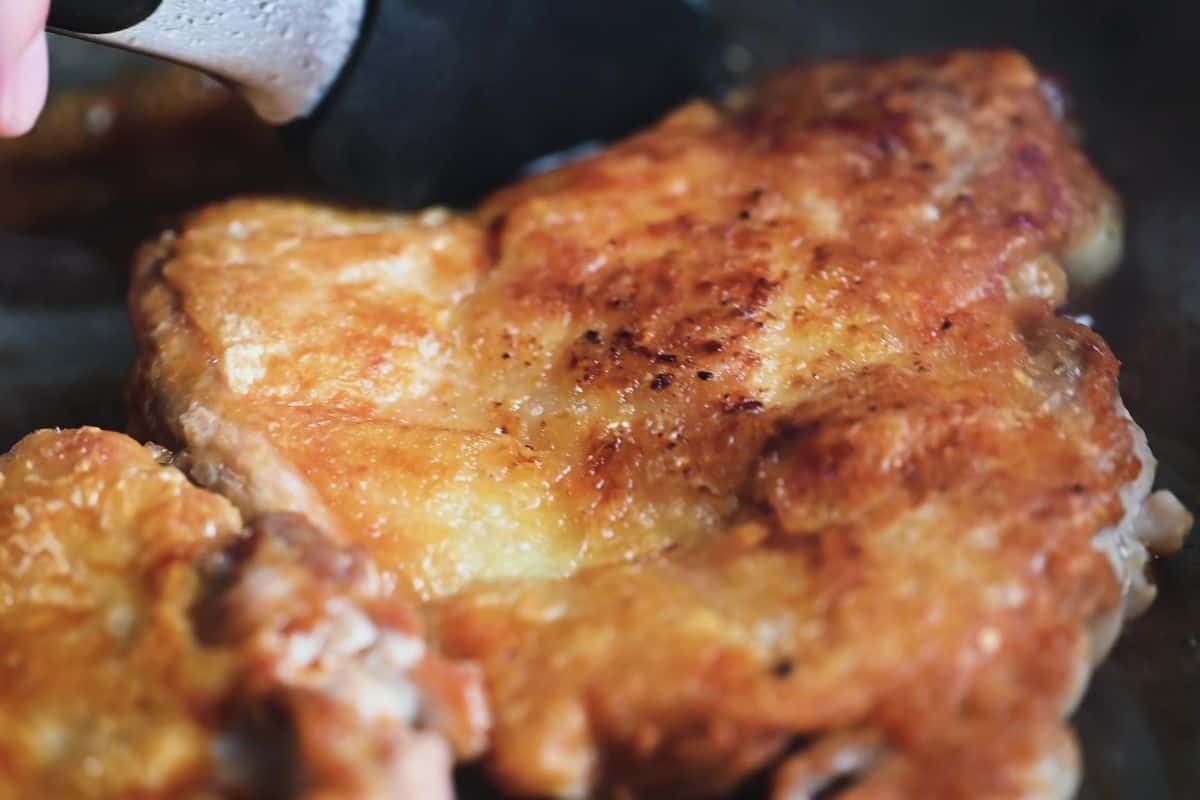 Glazing teriyaki chicken on the flesh side only to keep the skin crispy