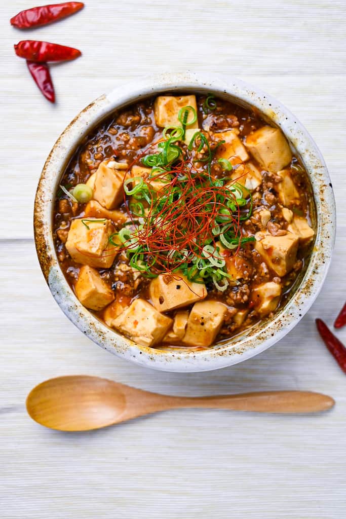 Mapo tofu topped with spring onion and chili threads