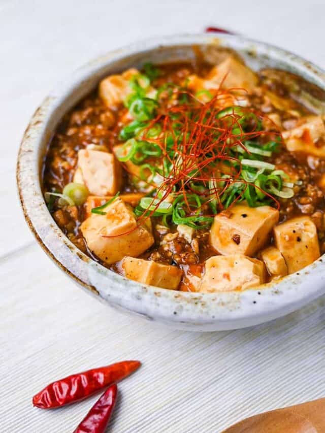 Mapo tofu topped with spring onion and chili threads