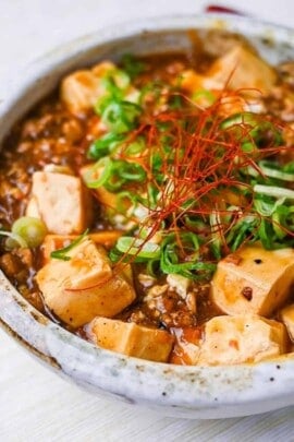 Japanese style mapo tofu topped with spring onion and chili threads