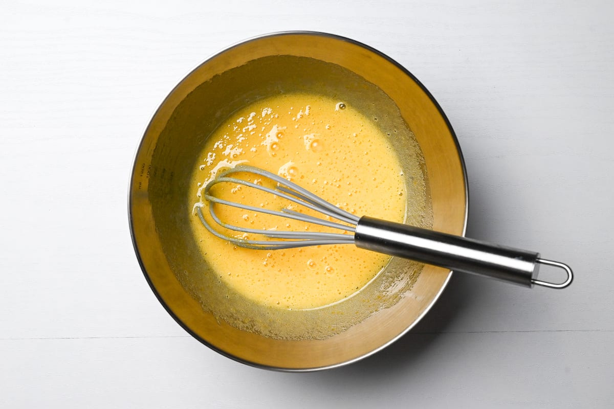 egg and sugar combined in a mixing bowl