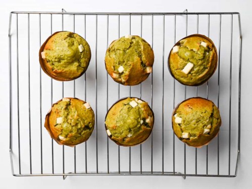 matcha muffins cooling on a wire rack