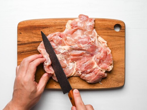 cutting thick parts of chicken thigh