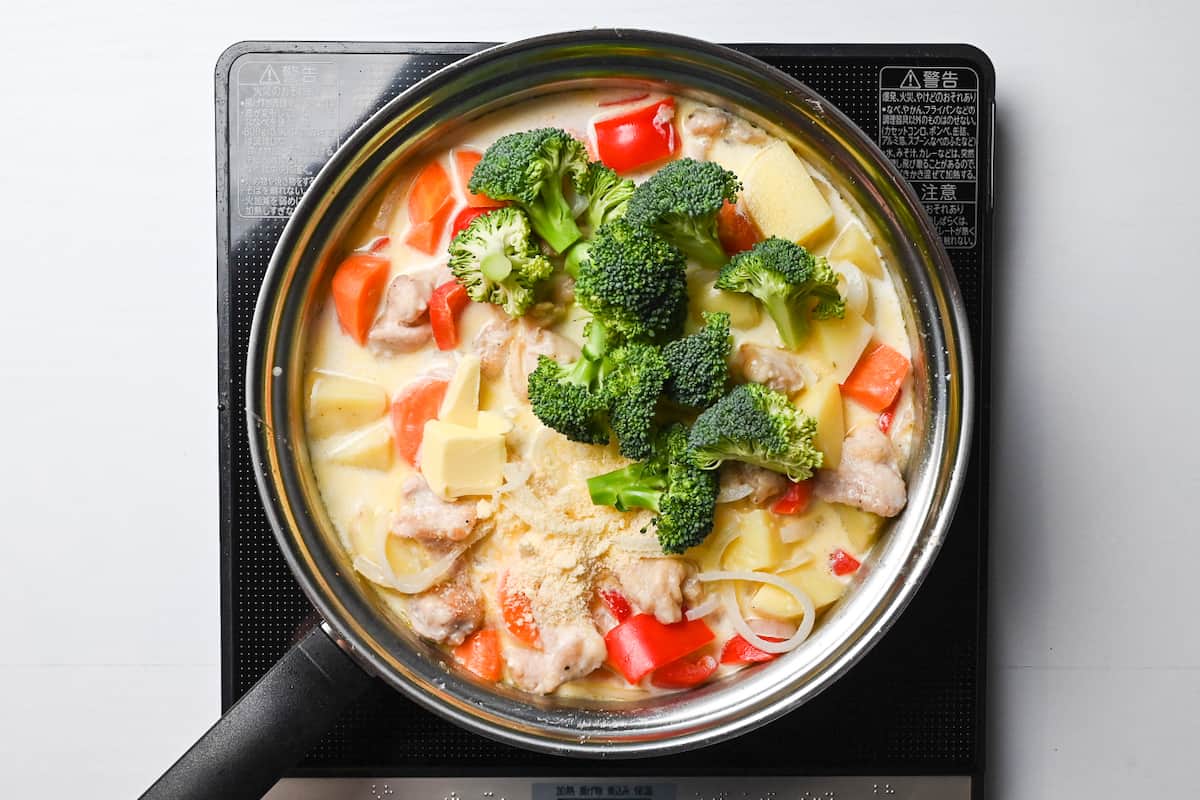 broccoli, butter and parmesan cheese added to the pan