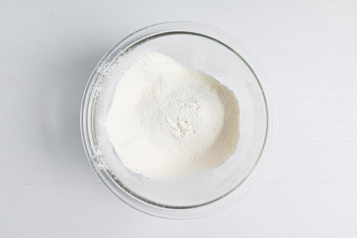 sifted flour with salt in a glass mixing bowl