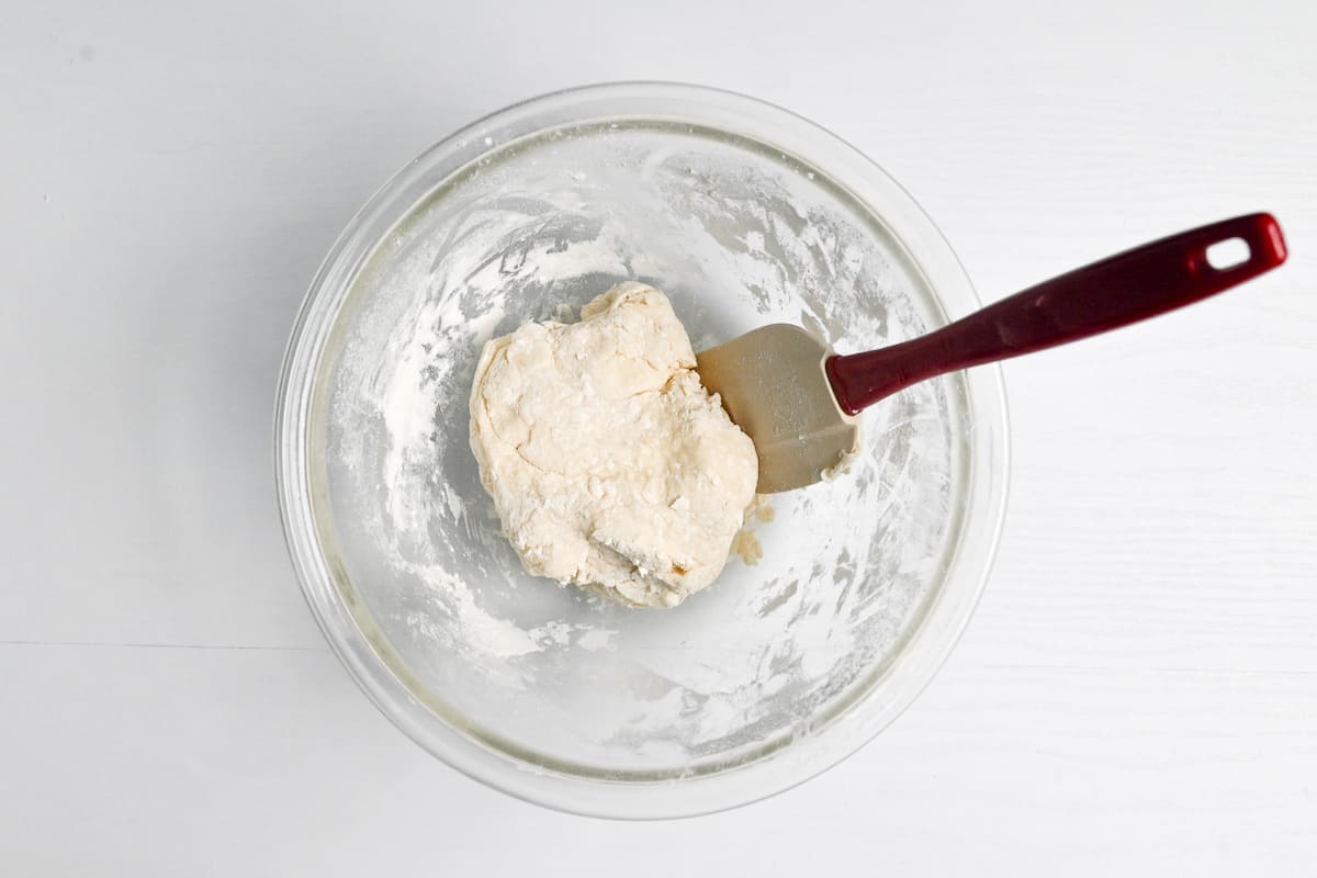 dough formed in a glass mixing bowl