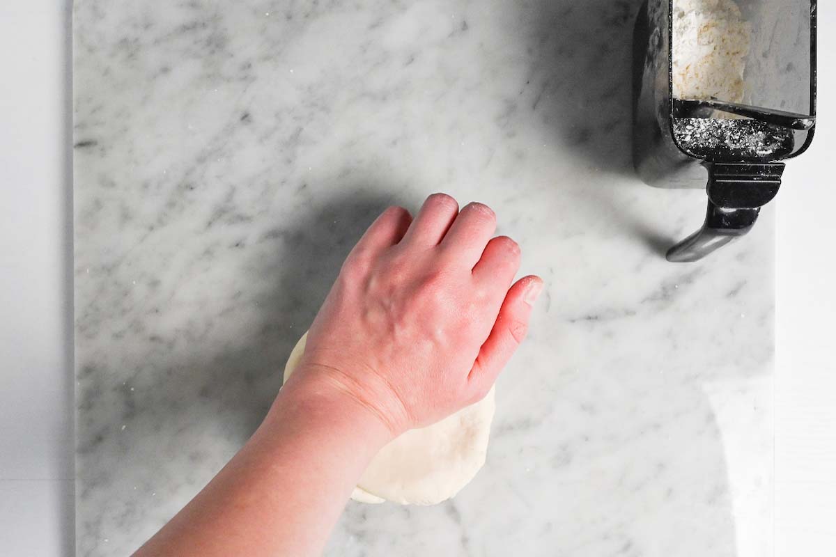 kneading dough by hand to make gyoza wrappers