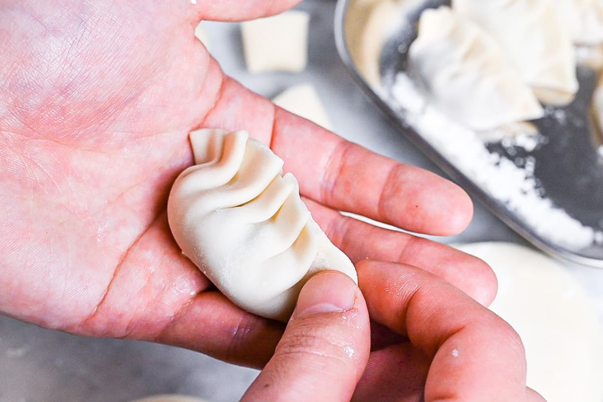 shaping a gyoza by hand