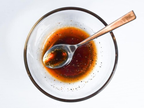 mixing gyoza sauce in a small glass bowl