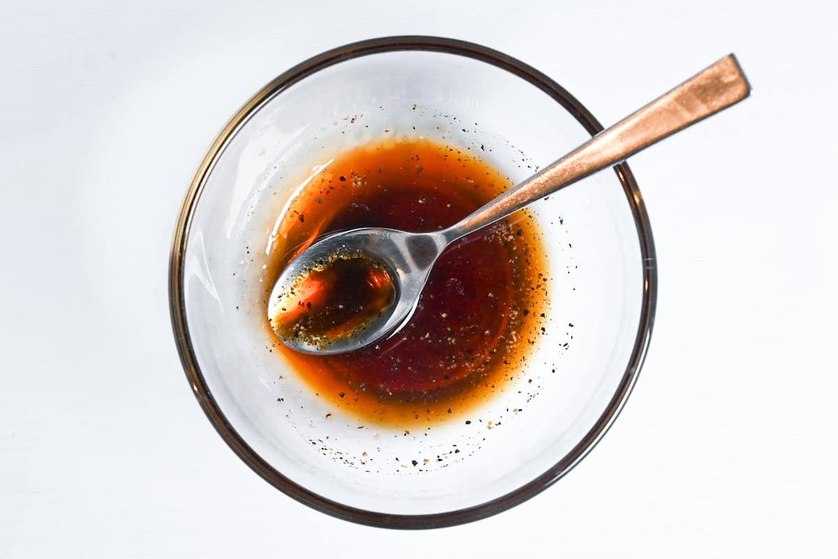 mixing gyoza sauce in a small glass bowl