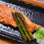miso salmon served with asparagus and grated daikon