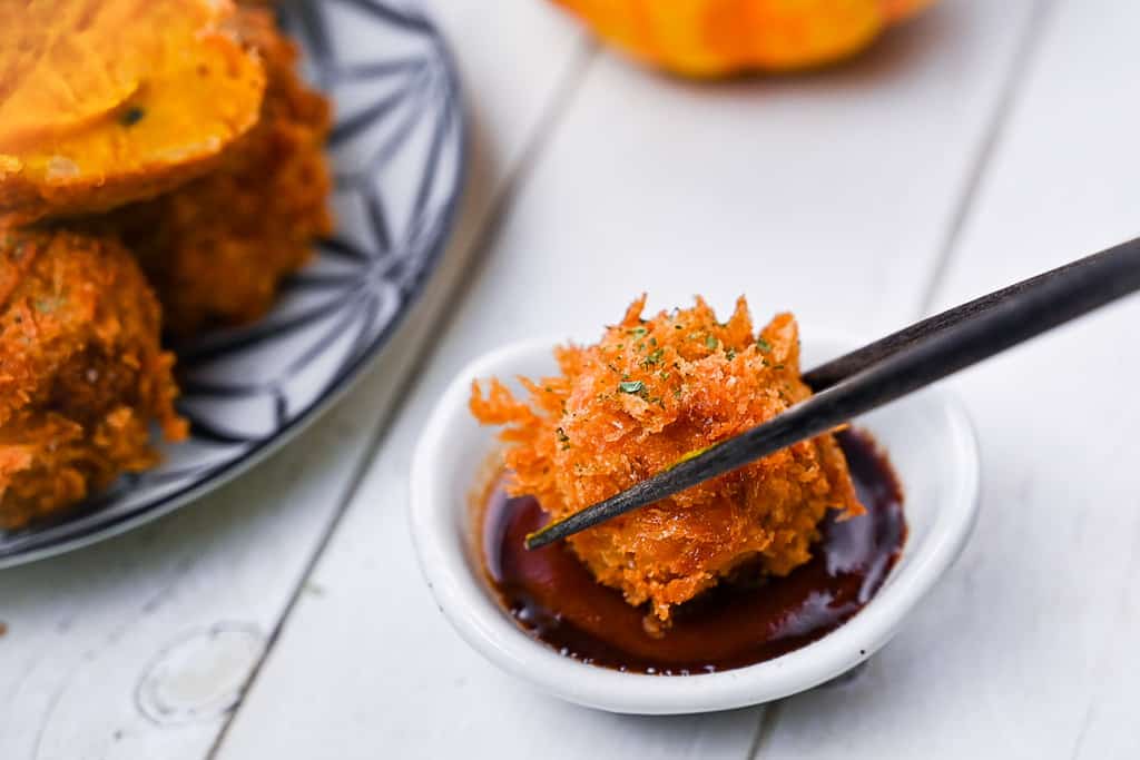 Pumpkin croquette dipped in sauce