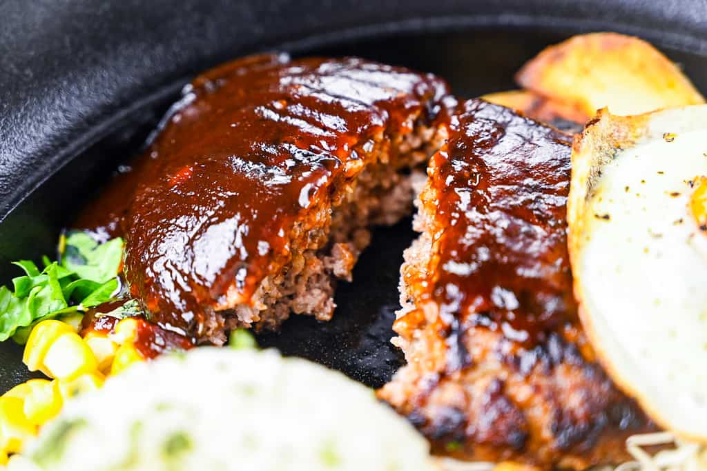 Japanese Hamburg steak coated in special sauce and cut in half