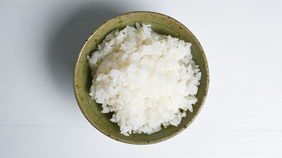 stove-cooked Japanese white rice in a green bowl