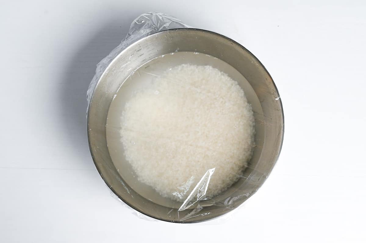 soaking rice in a bowl of water