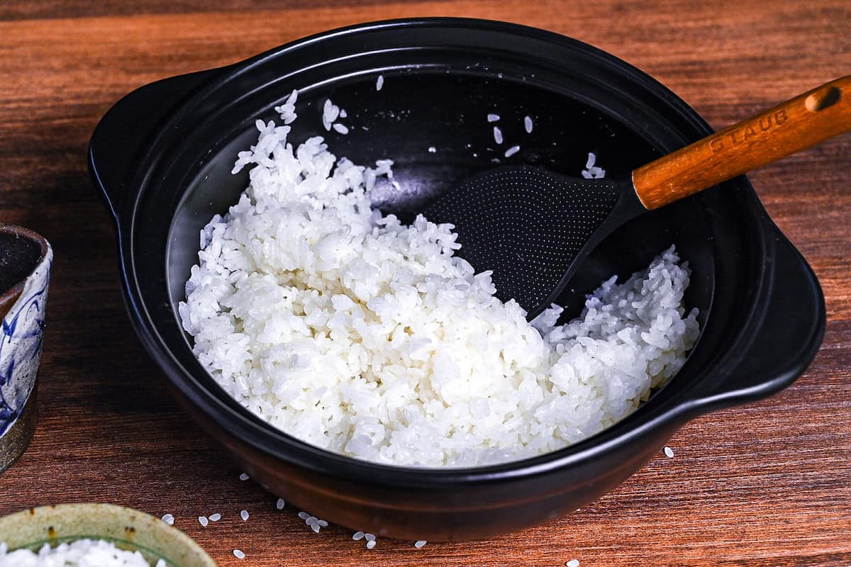 Cooked Japanese short-grain white rice in a black cooking pot
