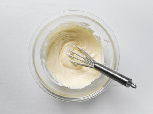 softened cream cheese whisked smooth in a large glass bowl