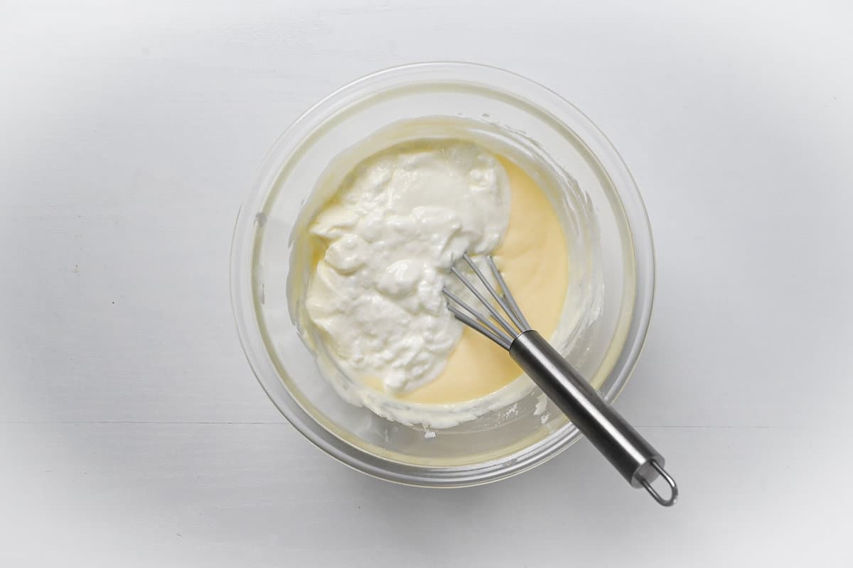 adding yogurt to cheesecake mixture