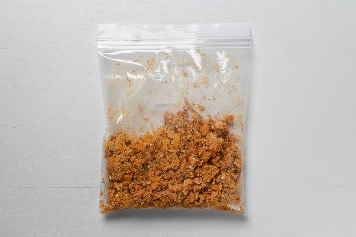 butter and crushed biscuits mixed in a ziplock bag