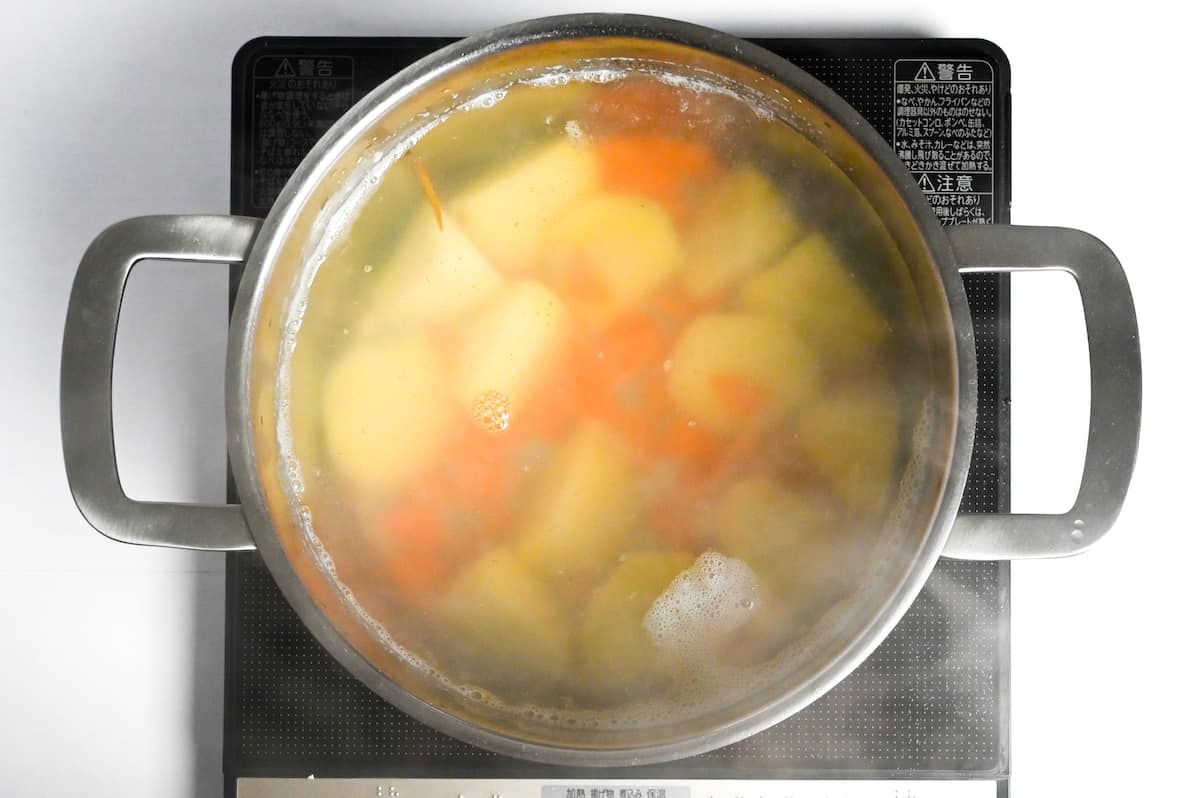 carrots added to pot of boiling potatoes