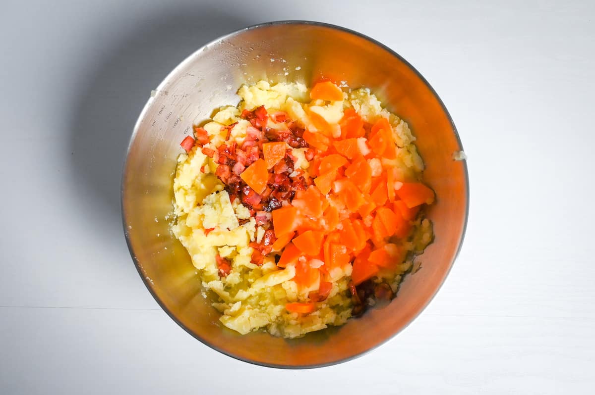 bacon and carrot in a bowl with mashed potato