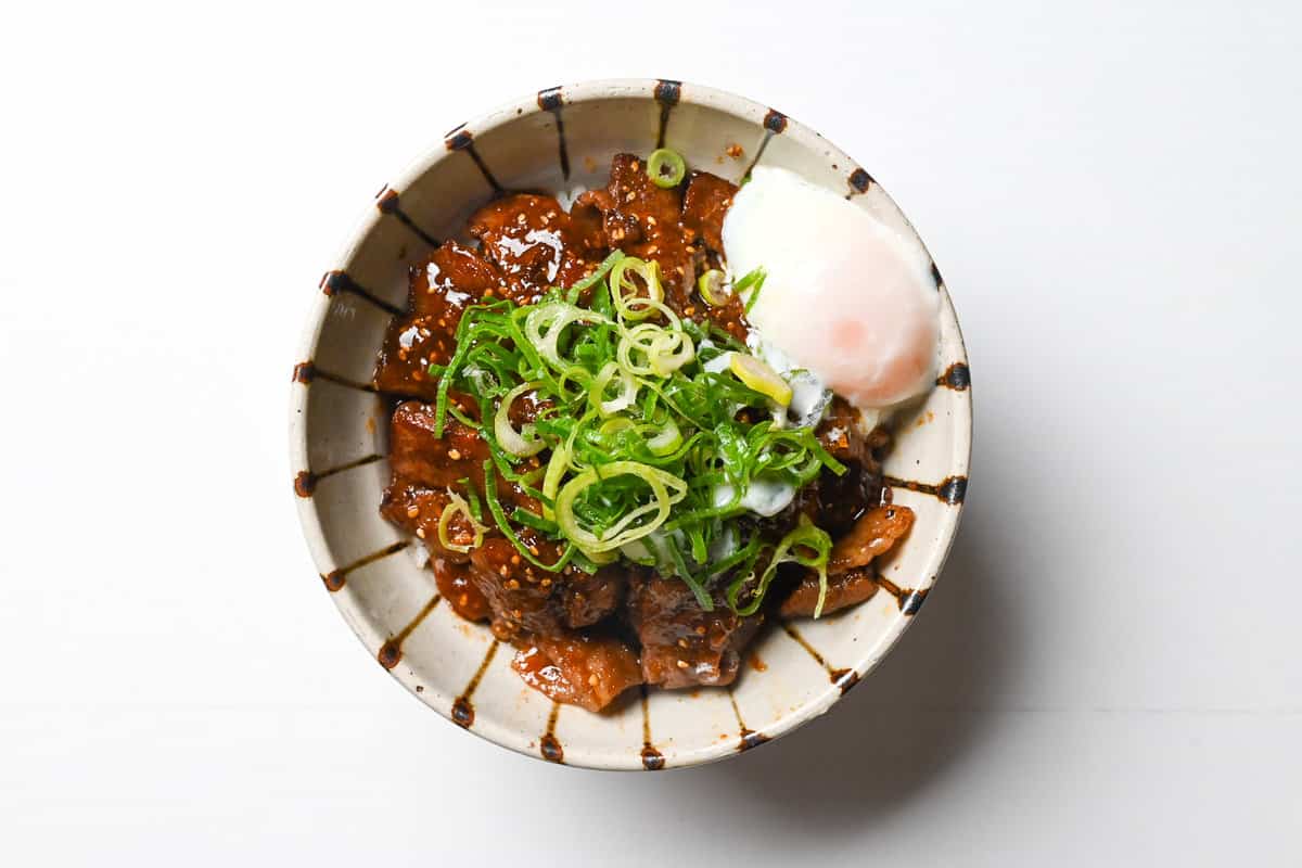 Yakiniku don topped with spring onion and soft boiled egg