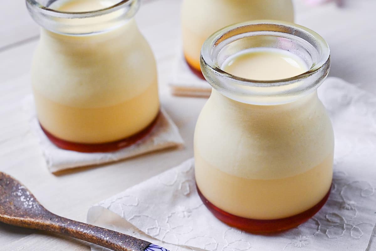 Japanese style custard pudding (purin) in glass jars side view
