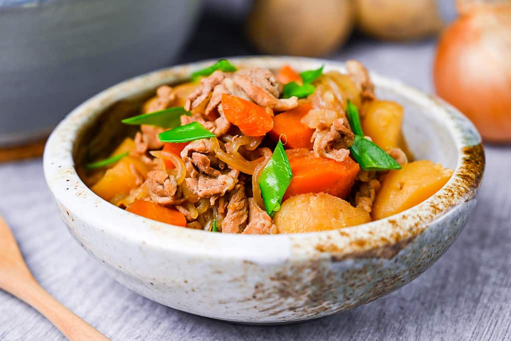 Japanese Nikujaga Meat and Potato Stew in a cream bowl