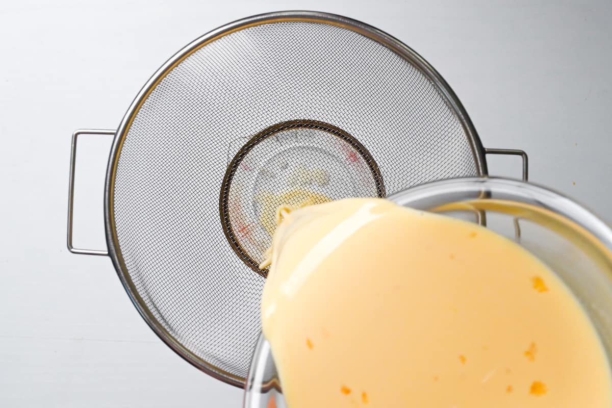 pouring purin mixture through sieve