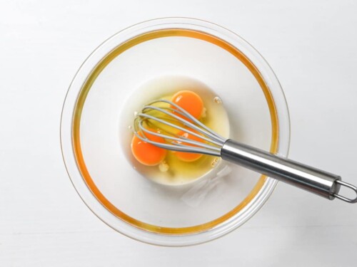 eggs cracked in a glass bowl