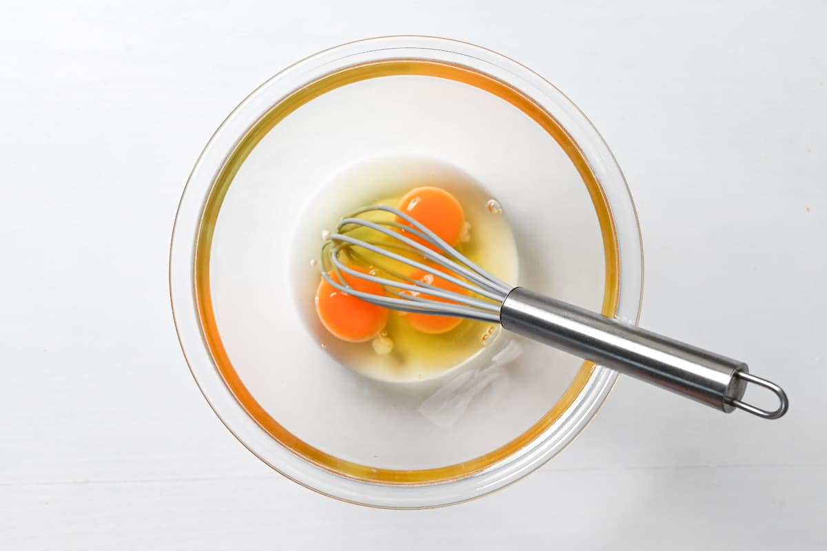 eggs cracked in a glass bowl