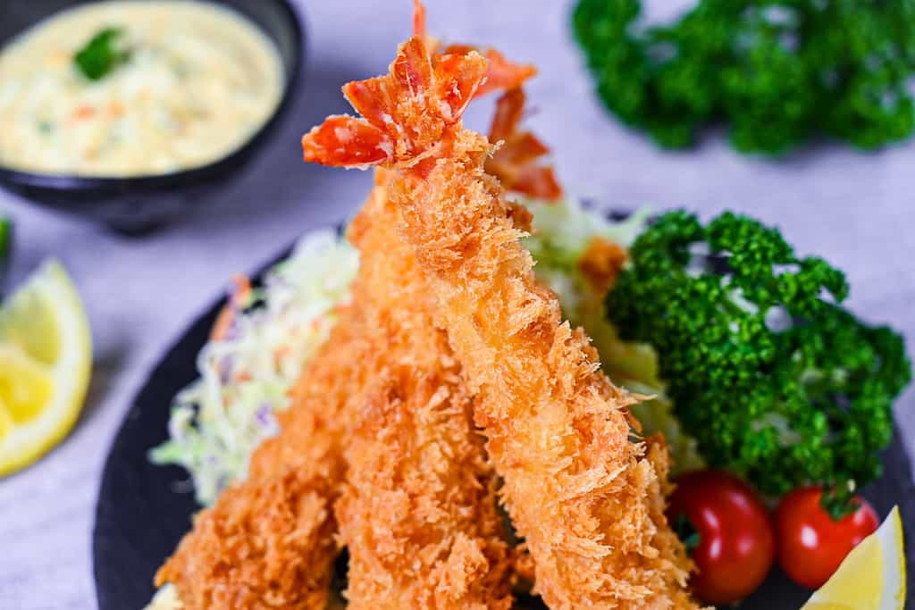 Ebi Fry (Japanese fried shrimp) served with tartar sauce, salad and lemon wedges