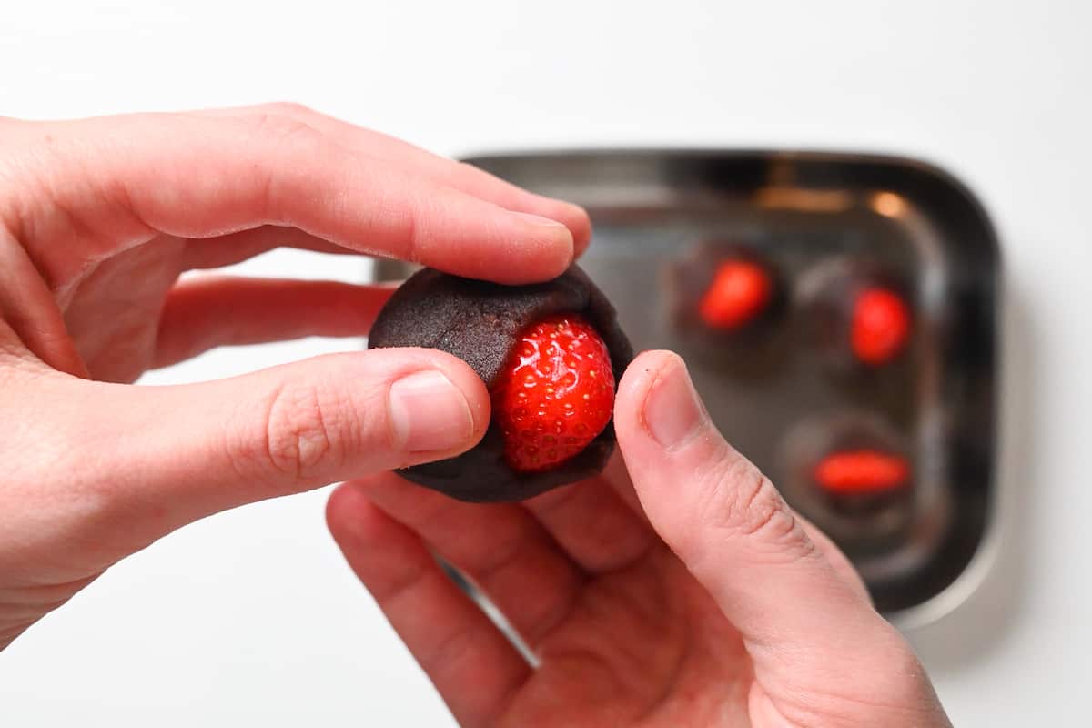 wrapping a strawberry with anko paste