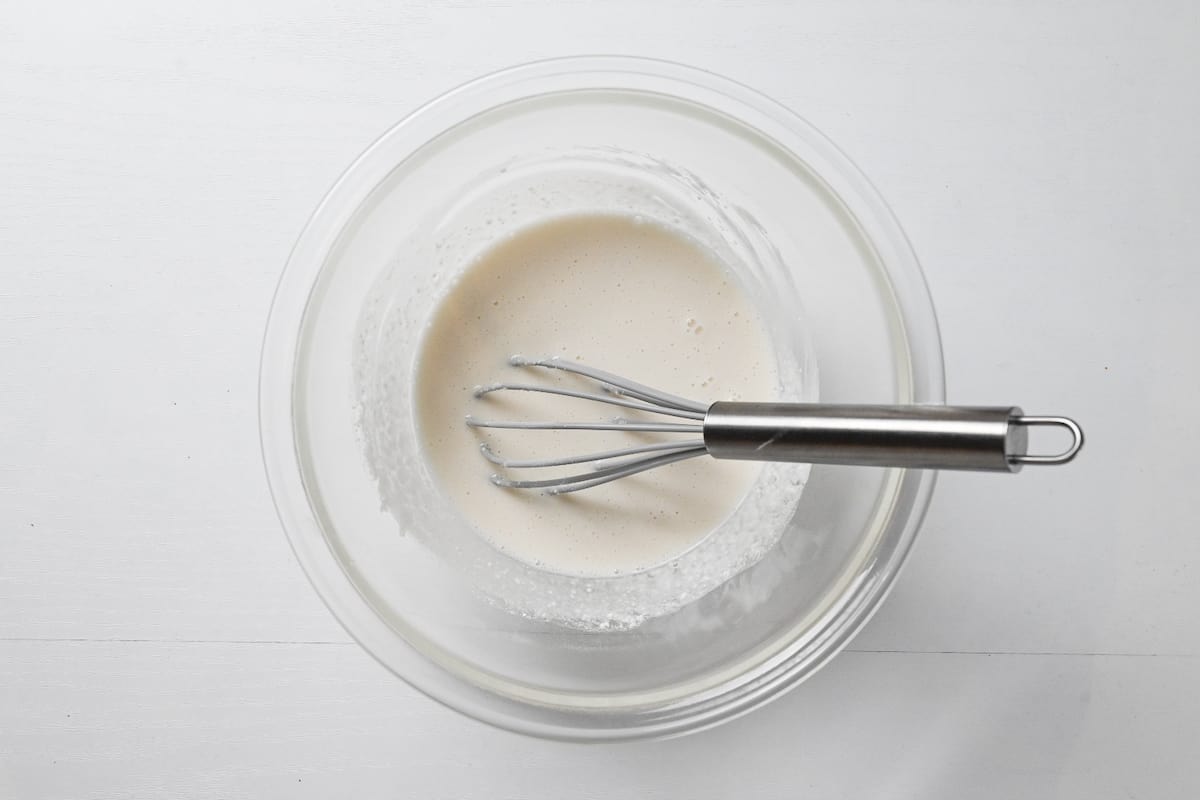 shiratamako and sugar mixed with water in a glass bowl