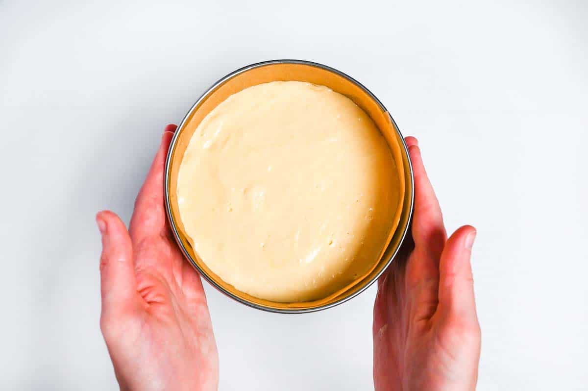 Genoise sponge mixture in a cake tin