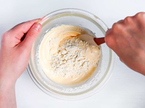 Folding sifted flour into whipped eggs