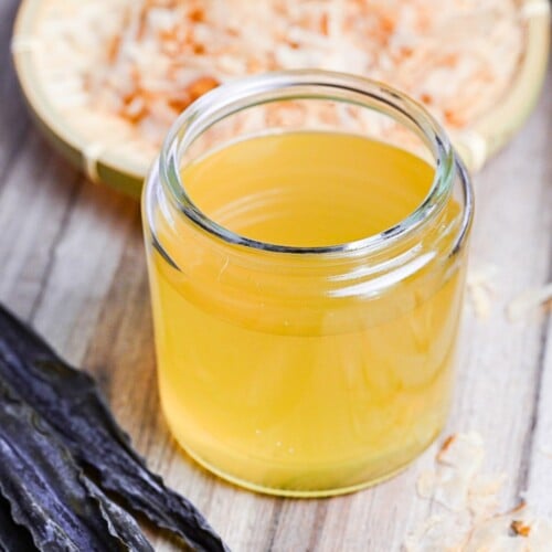 awase dashi in a jar with kombu in the foreground and katsuobushi in the background