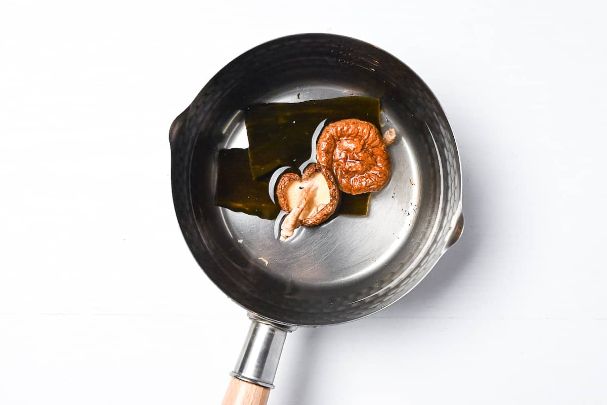 kombu and shiitake soaking in a pan of water