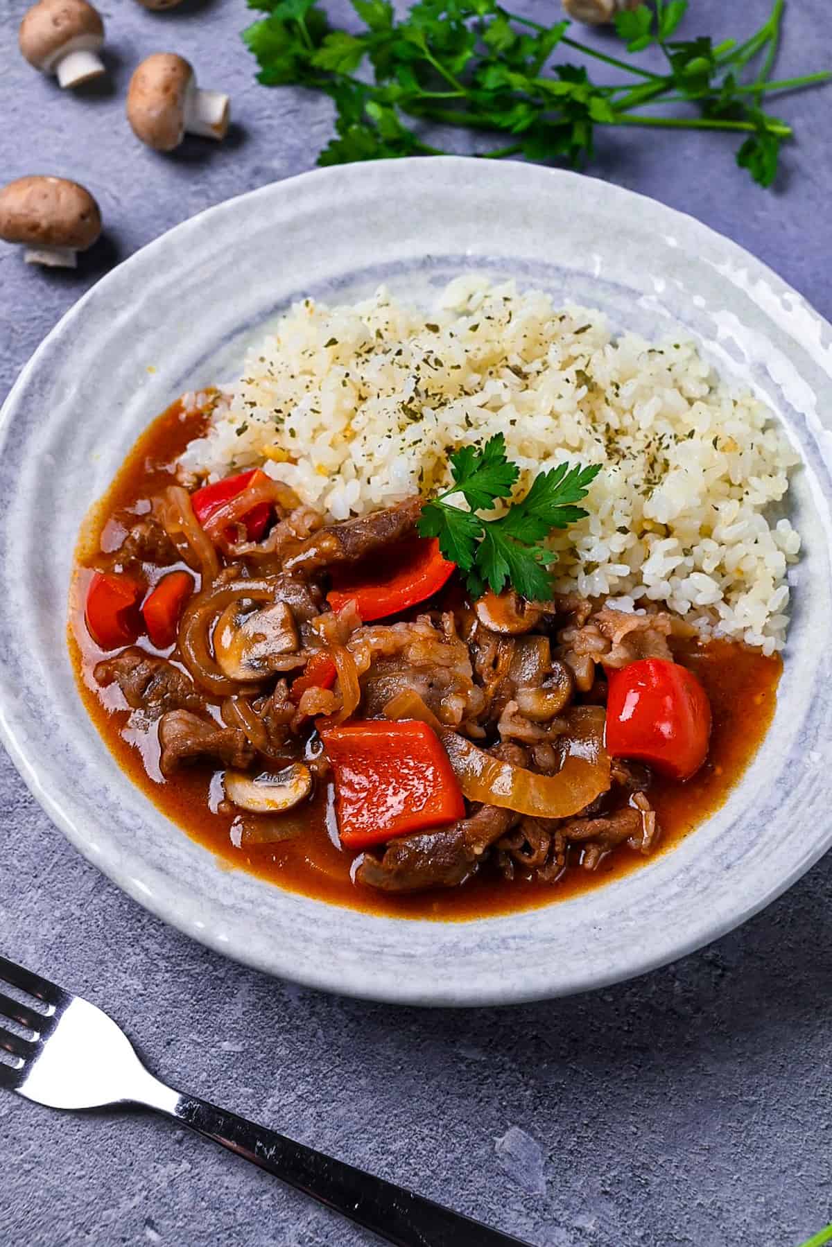 Japanese beef hayashi rice with garlic butter rice topped with fresh parsley