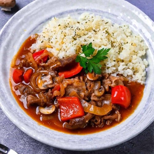 Japanese beef hayashi rice with garlic butter rice topped with fresh parsley