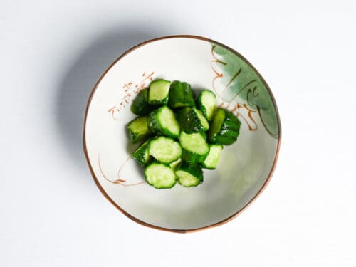 Wasabi pickled cucumber after 12 hours in a Japanese serving dish.