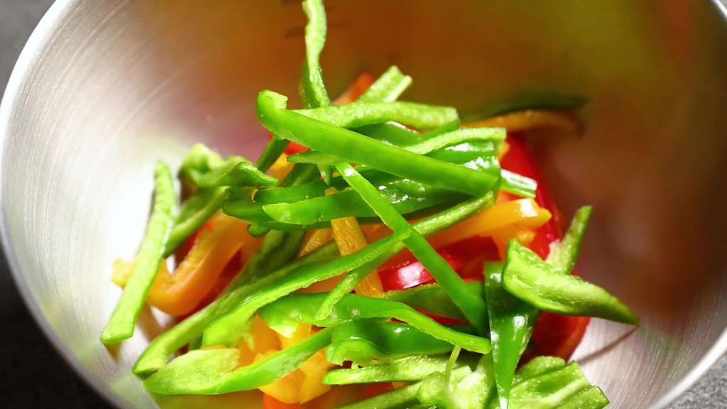 Finely chopped bell peppers in a bowl