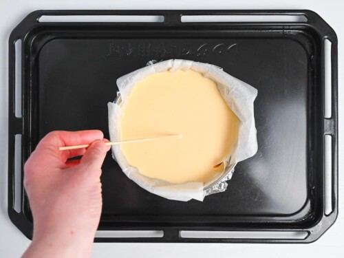 Removing air bubbles from surface of basque-style cheesecake