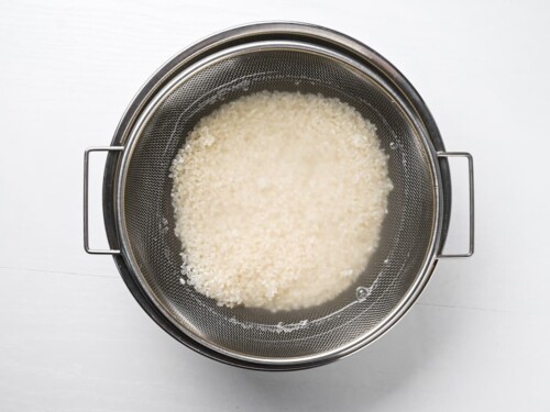 Washing rice in a bowl
